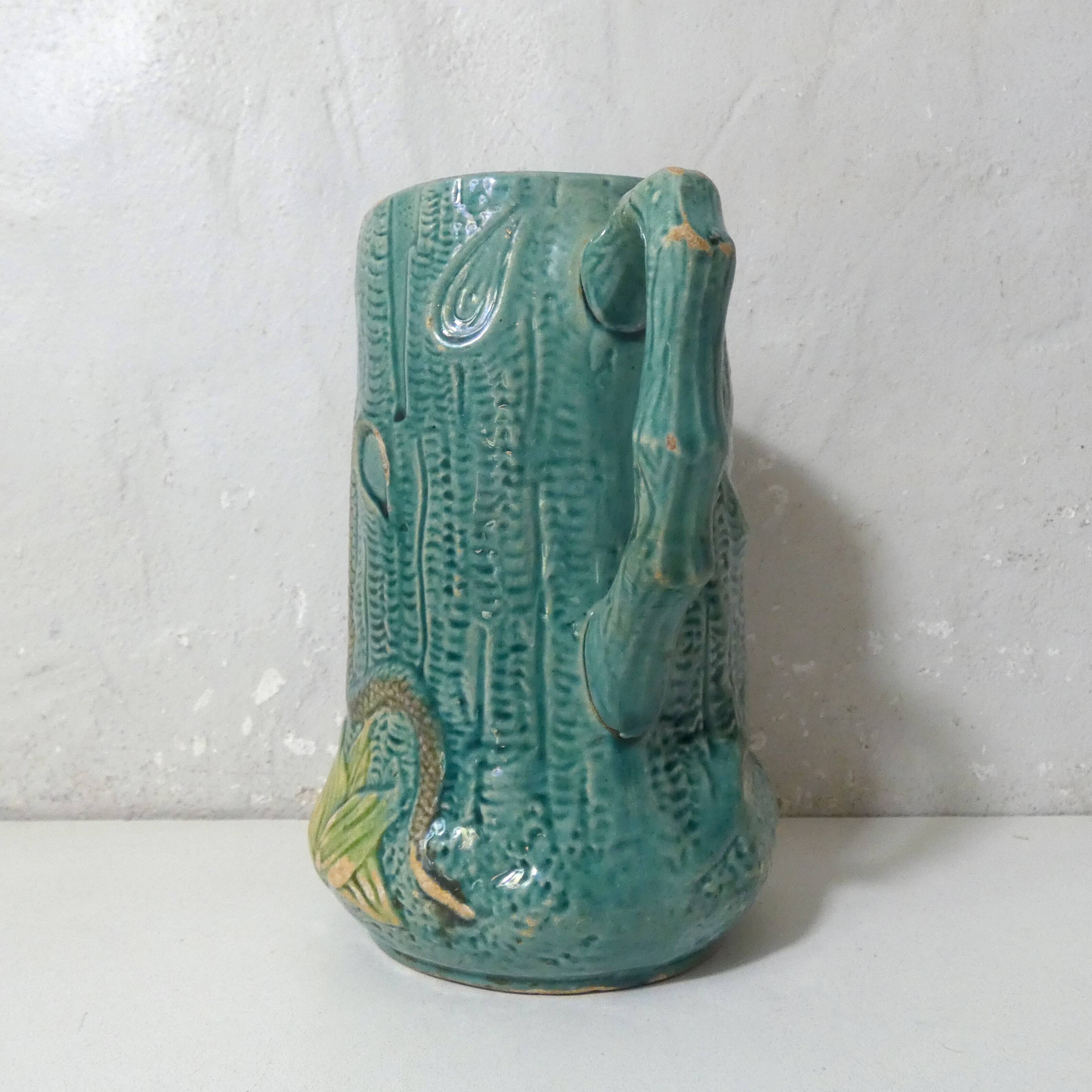 Antique turquoise Art Deco majolica pitcher vase with a snake motif