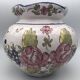 Round earthenware vase with polychrome floral motifs, signed
