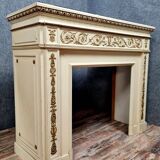 Louis XVI fireplace made in the 19th century, all in lacquered and gilded wood with decorative attributes