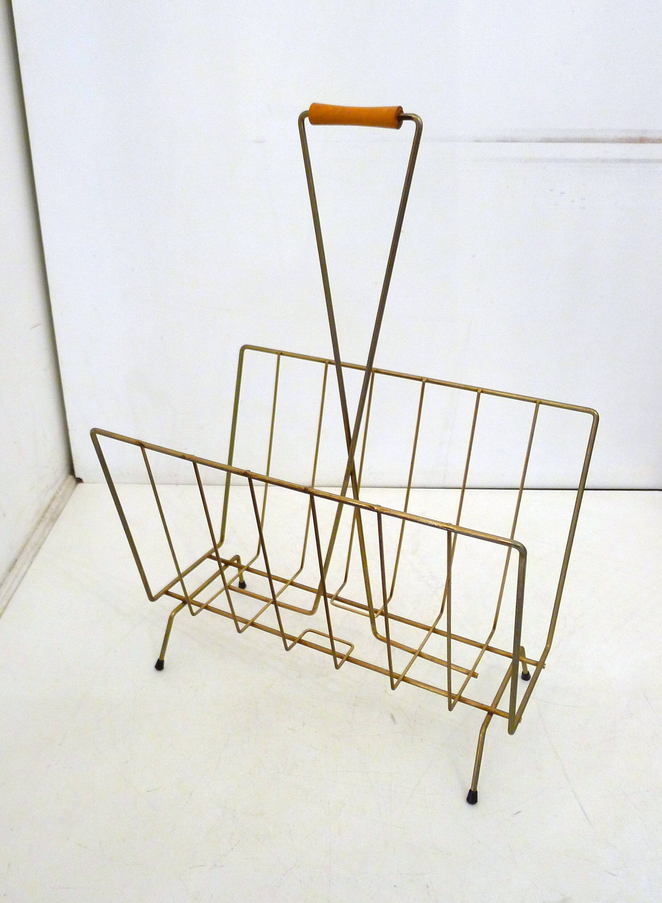 Mid-century openwork magazine rack, in gold metal & wooden handle.