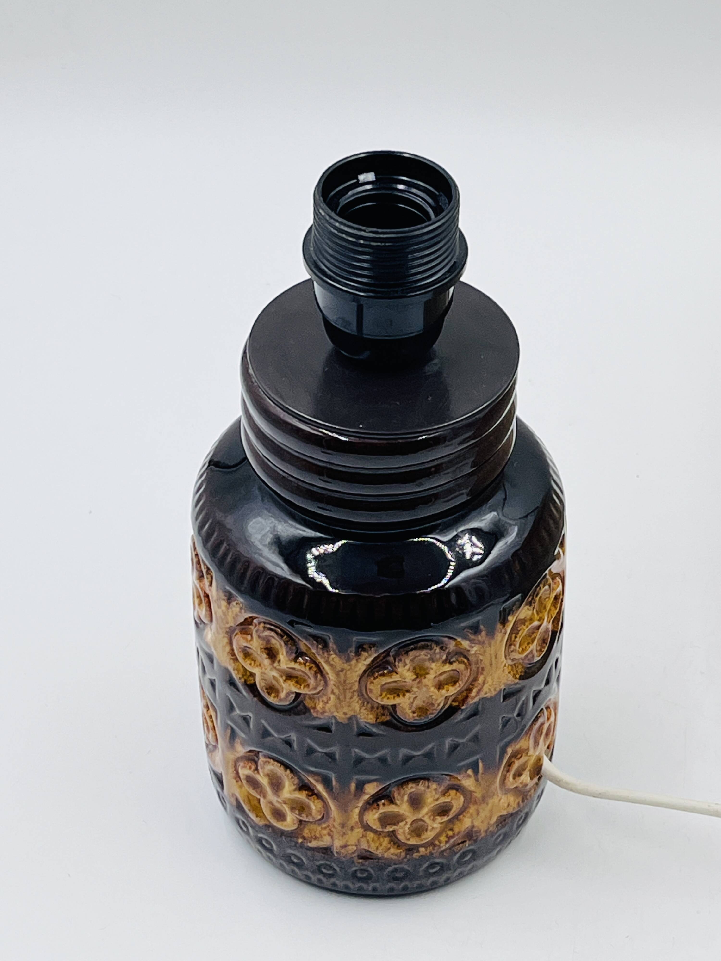 Vintage ceramic lamp with relief and wool shade.