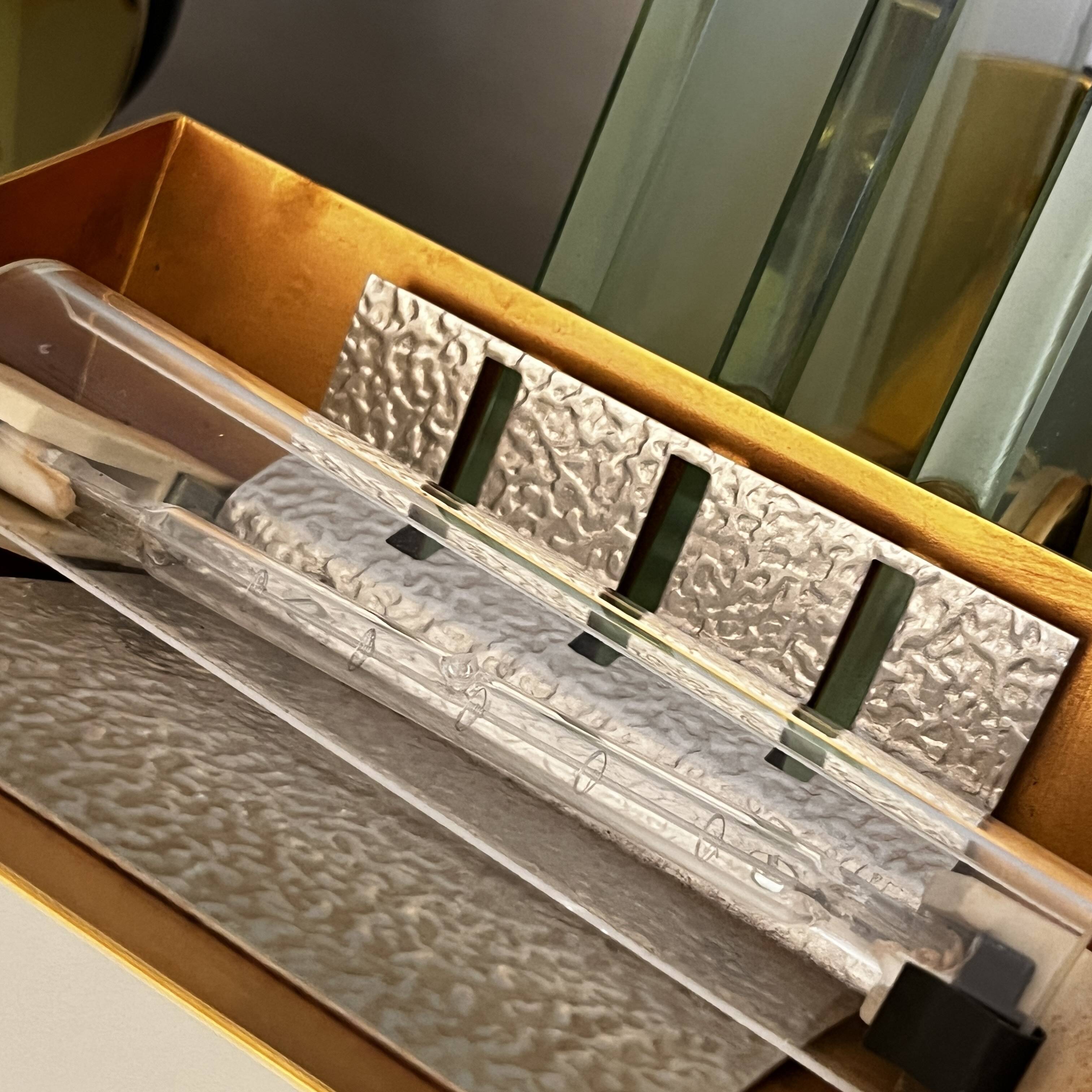 Pair of Hollywood Regency wall lights, bases & reflectors in gilded brass