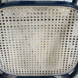 Rocking-chair en bois courbé noirci et cannage années 1900