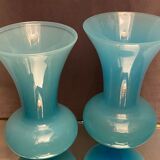 Two vases on a pedestal in blue opaline