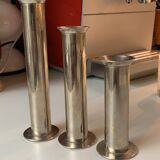 Three silver metal candle holders