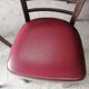 Set of 19 vintage wooden bistro chairs with red faux leather.