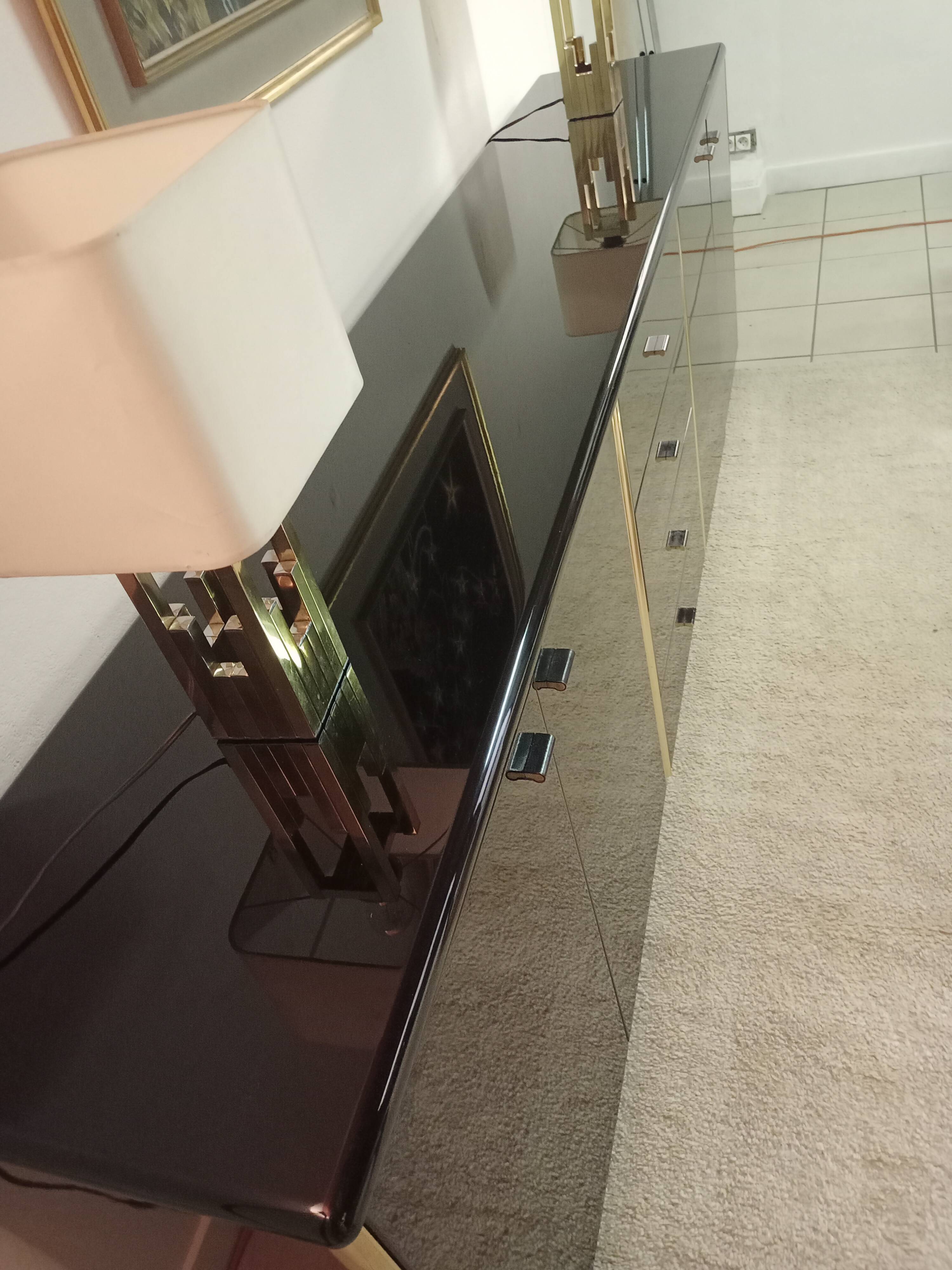 Black lacquered and brass design 70/80