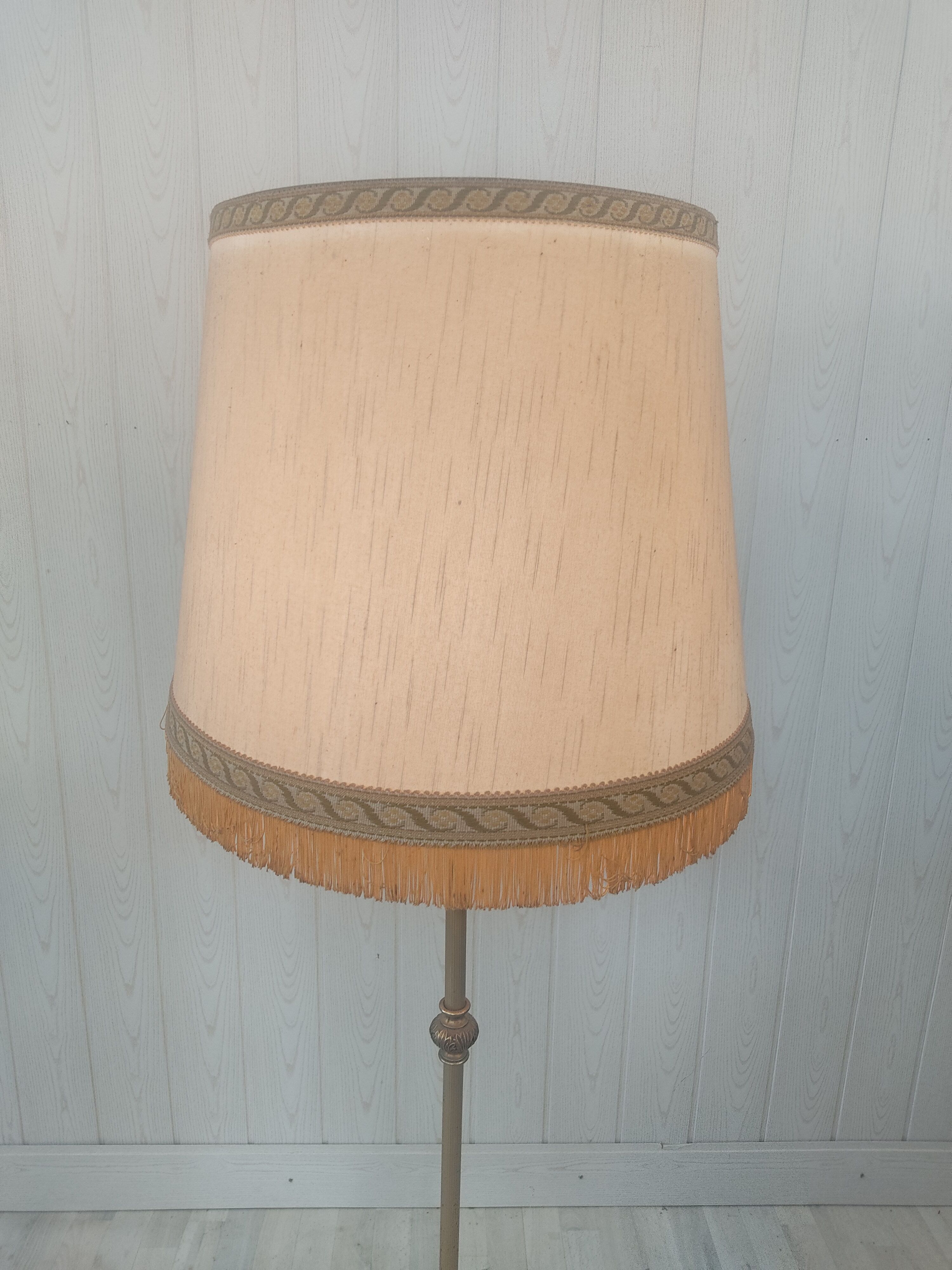 Gilded metal tripod floor lamp