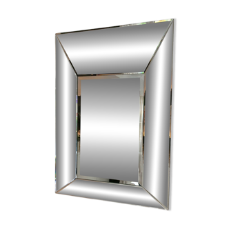 Asymmetrical beveled mirror