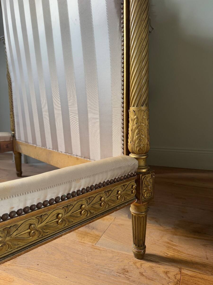 Pair of late 19th-century gilded wooden beds in Louis XVI style.