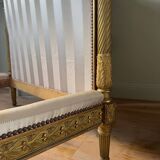 Pair of late 19th-century gilded wooden beds in Louis XVI style.