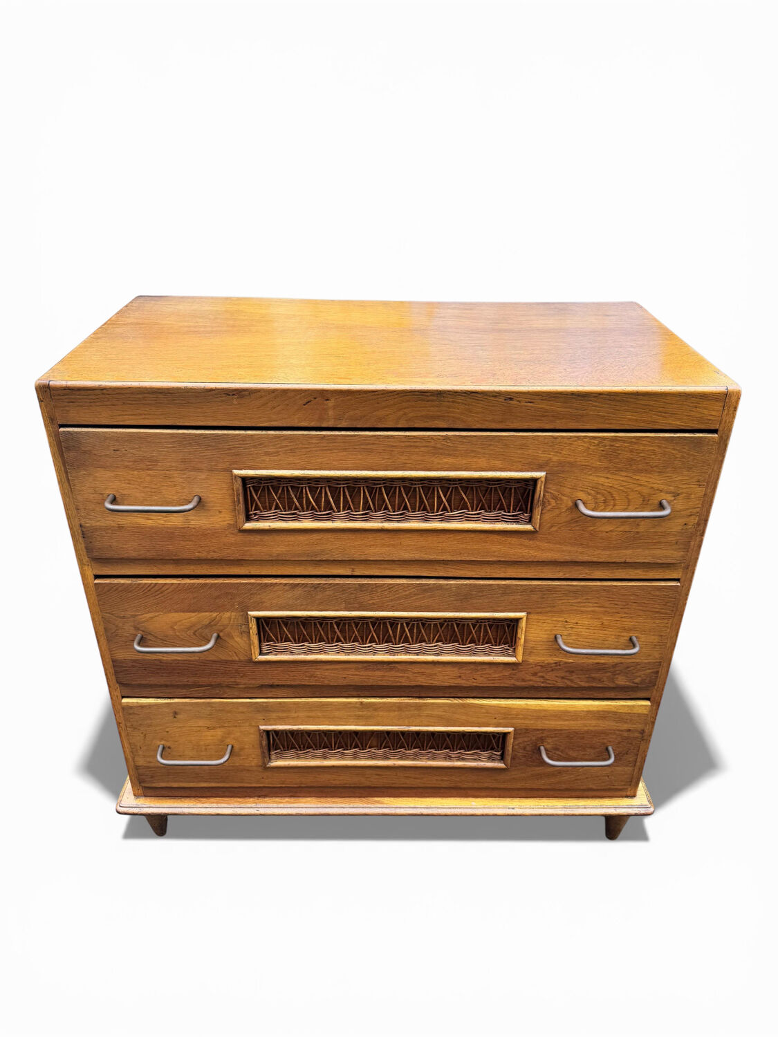 Vintage 1970s chest of drawers: wood and rattan, splayed legs.