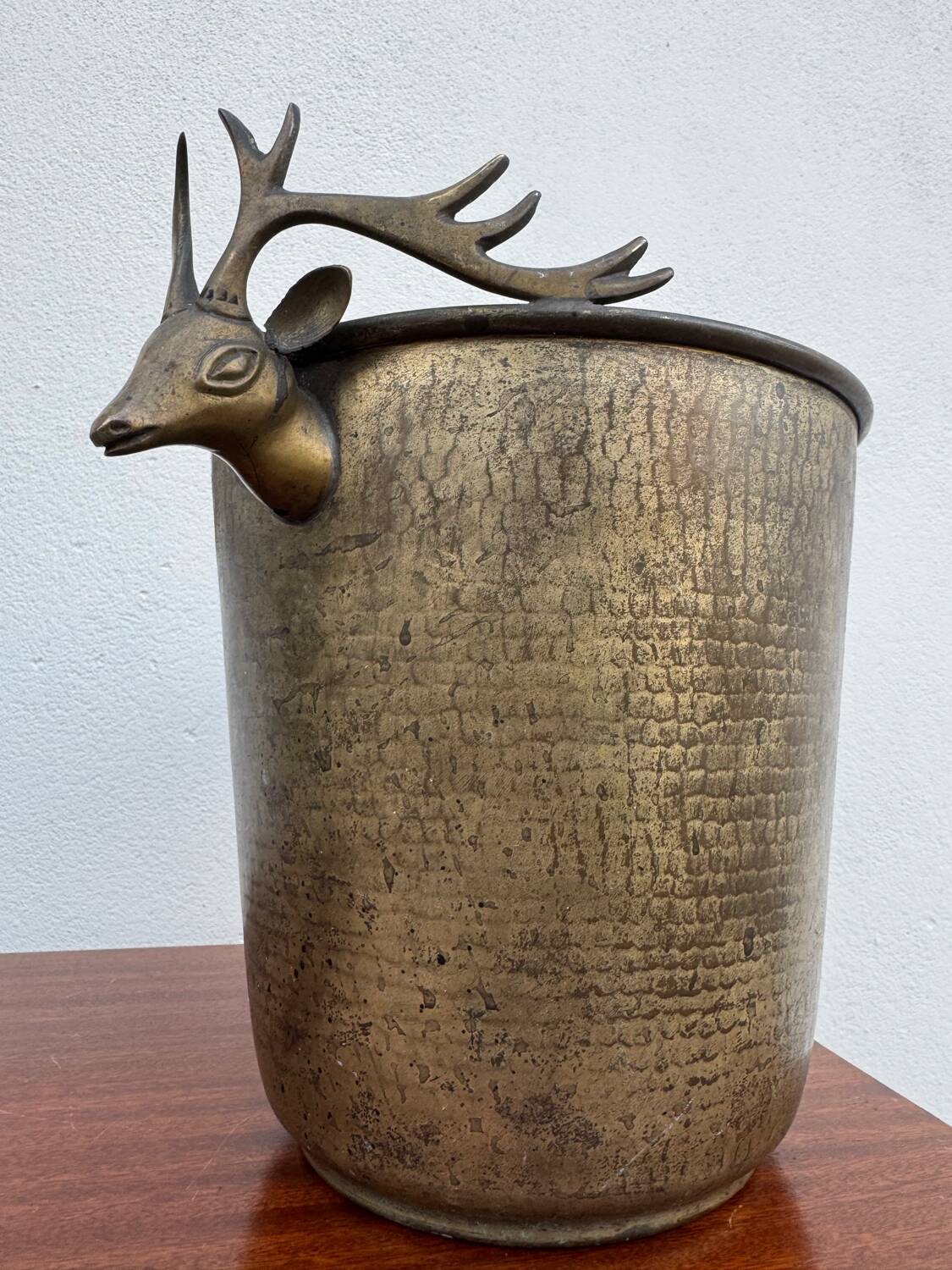 Antique champagne cooler with stag heads