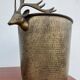 Antique champagne cooler with stag heads