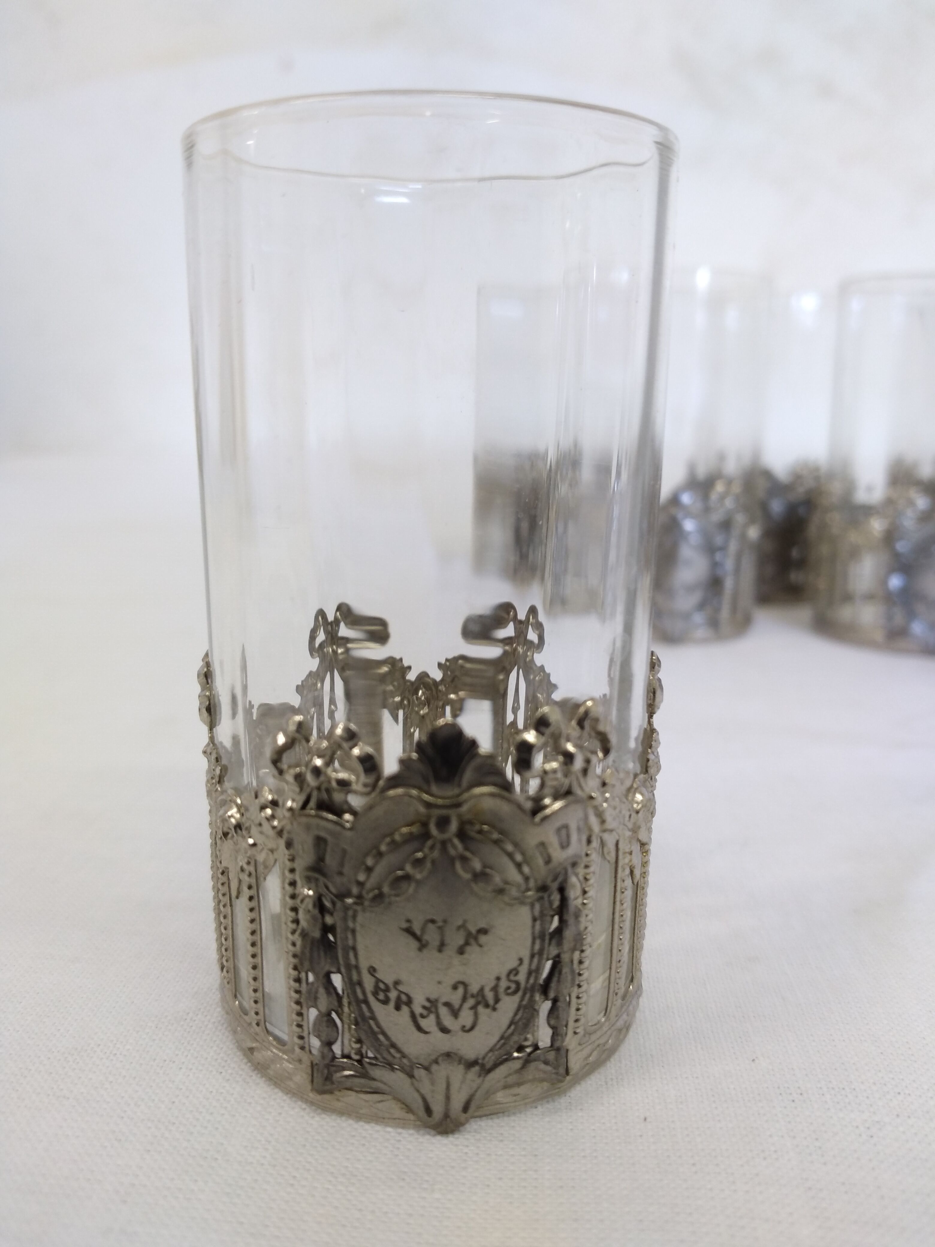 Glass with art deco strapping