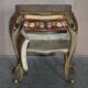 Pair of curved walnut commodes with marquetry and marble tops.