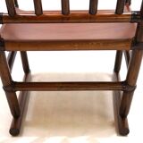Manou rattan armchair with leather seat, 1960