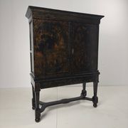 A rare early 18th-century Dutch japanned chinoiserie cabinet, circa 1700