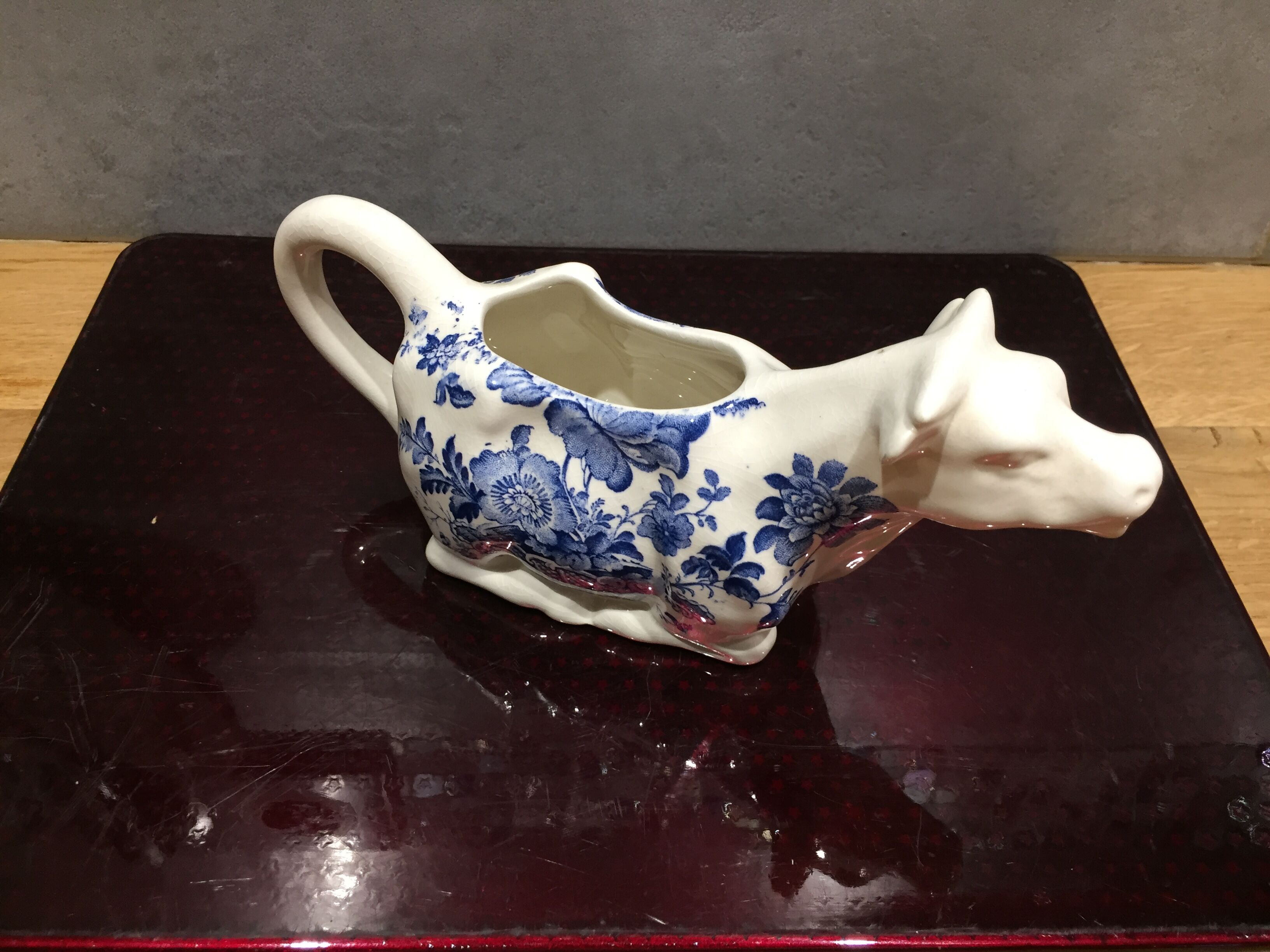 English porcelain cow-shaped sauce dish