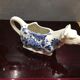 English porcelain cow-shaped sauce dish