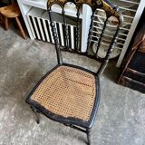 Napoleon III chair in black and gold wood with caning.