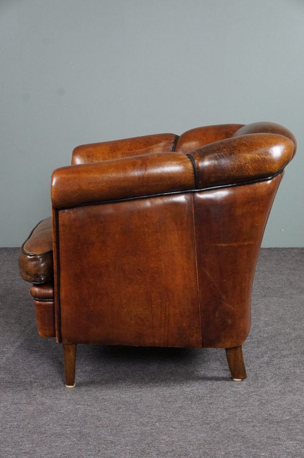 Club armchair in warm coloured sheepskin