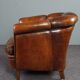 Club armchair in warm coloured sheepskin