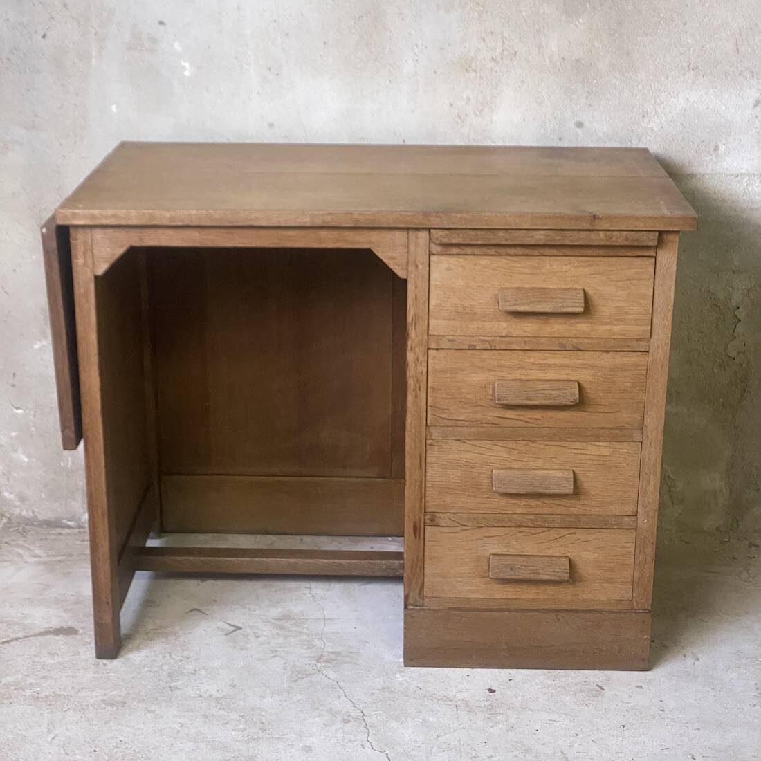 Vintage 1950s children's desk made of solid wood.