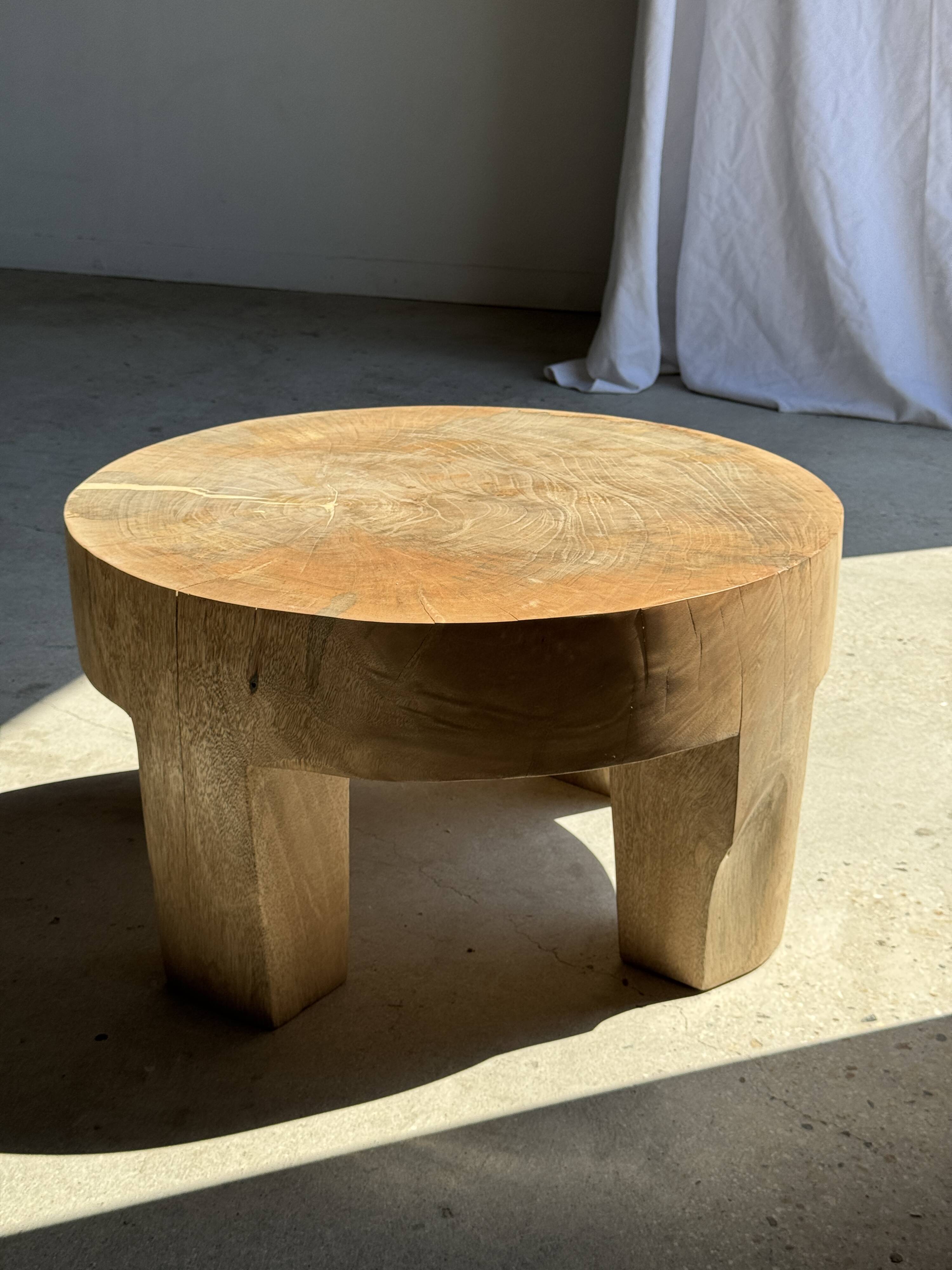 Coffee table, four-legged low table in natural solid monoxyle mango wood.
