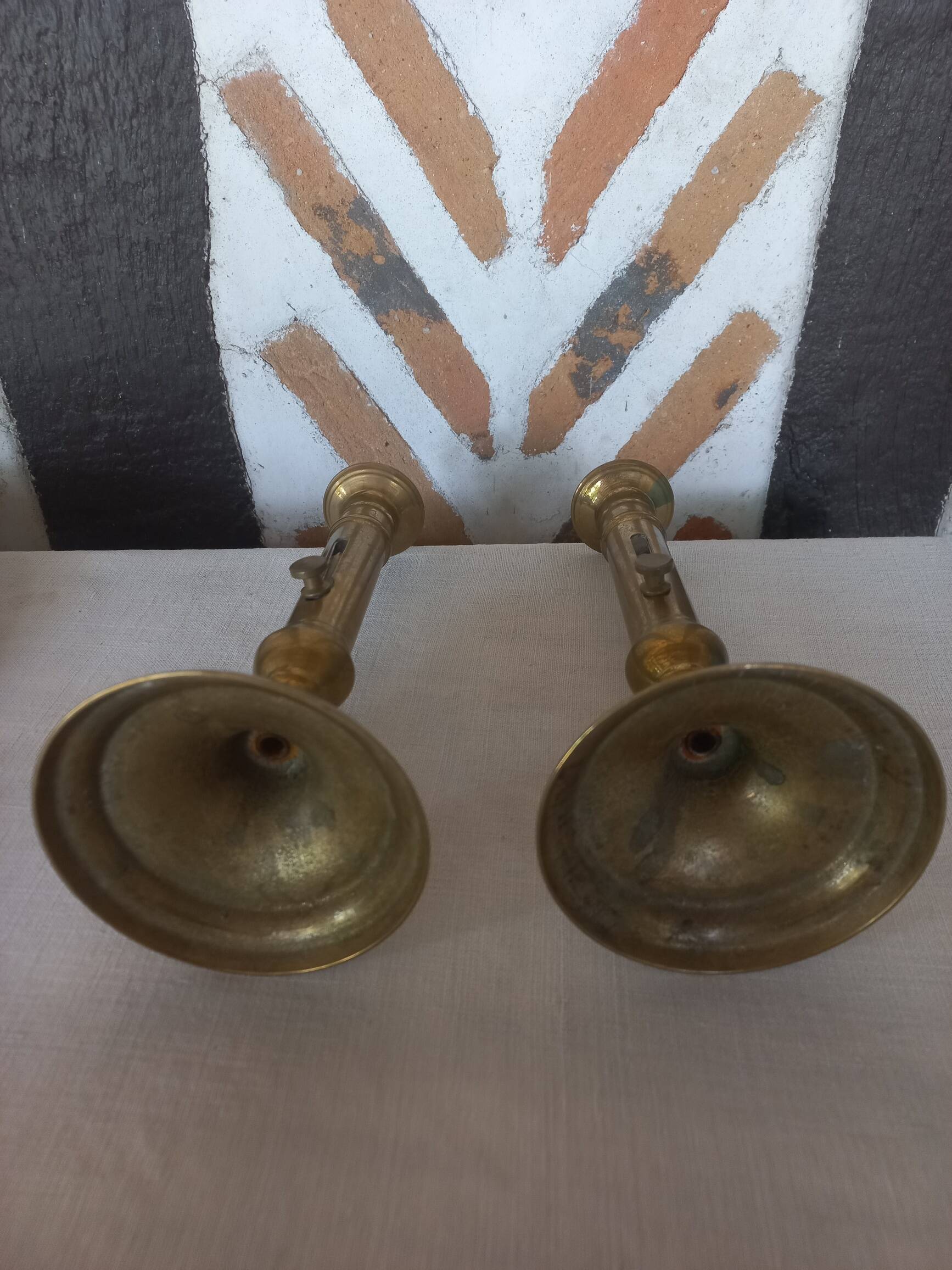 Pair of brass push-button candlesticks