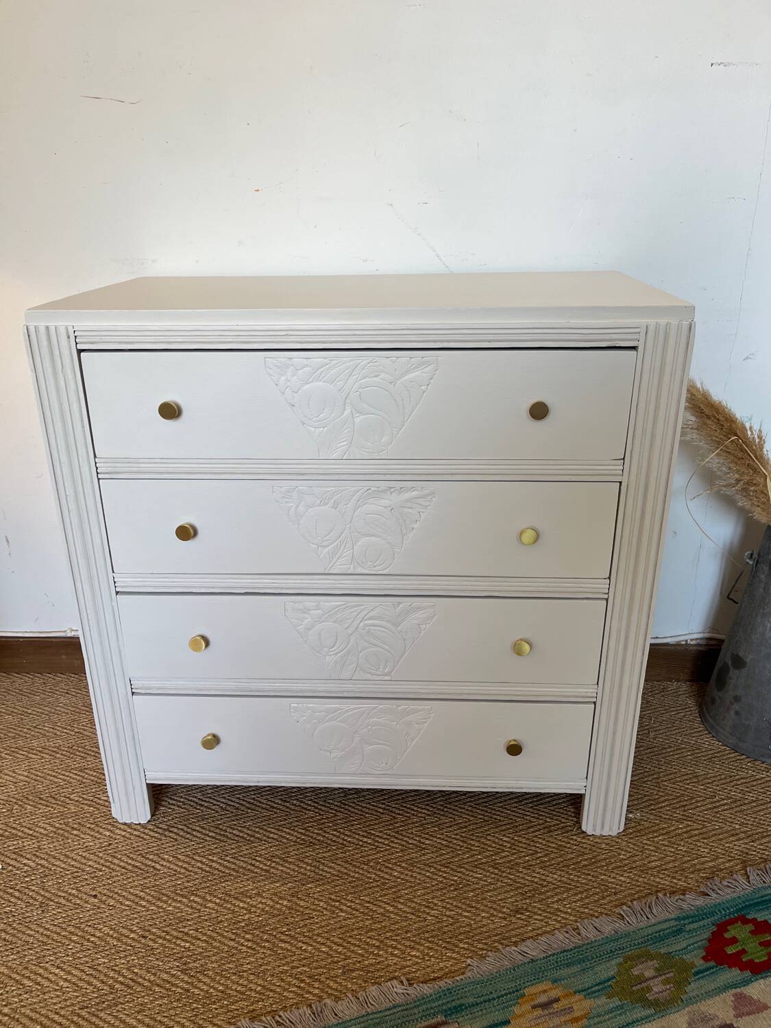 Restored wooden art deco chest of drawers with gilded handles