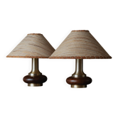 Lot of 2 vintage table lamps from the 1970s, dark wood oval bases with curved brass details, handmade natural fibre lampshades, elegant lighting.