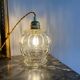 Walking lamp with vintage globe in transparent molded glass