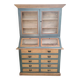 Large two-body grain merchant cabinet made of solid wood.