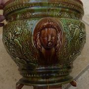 Old earthenware cachepot with woman decoration