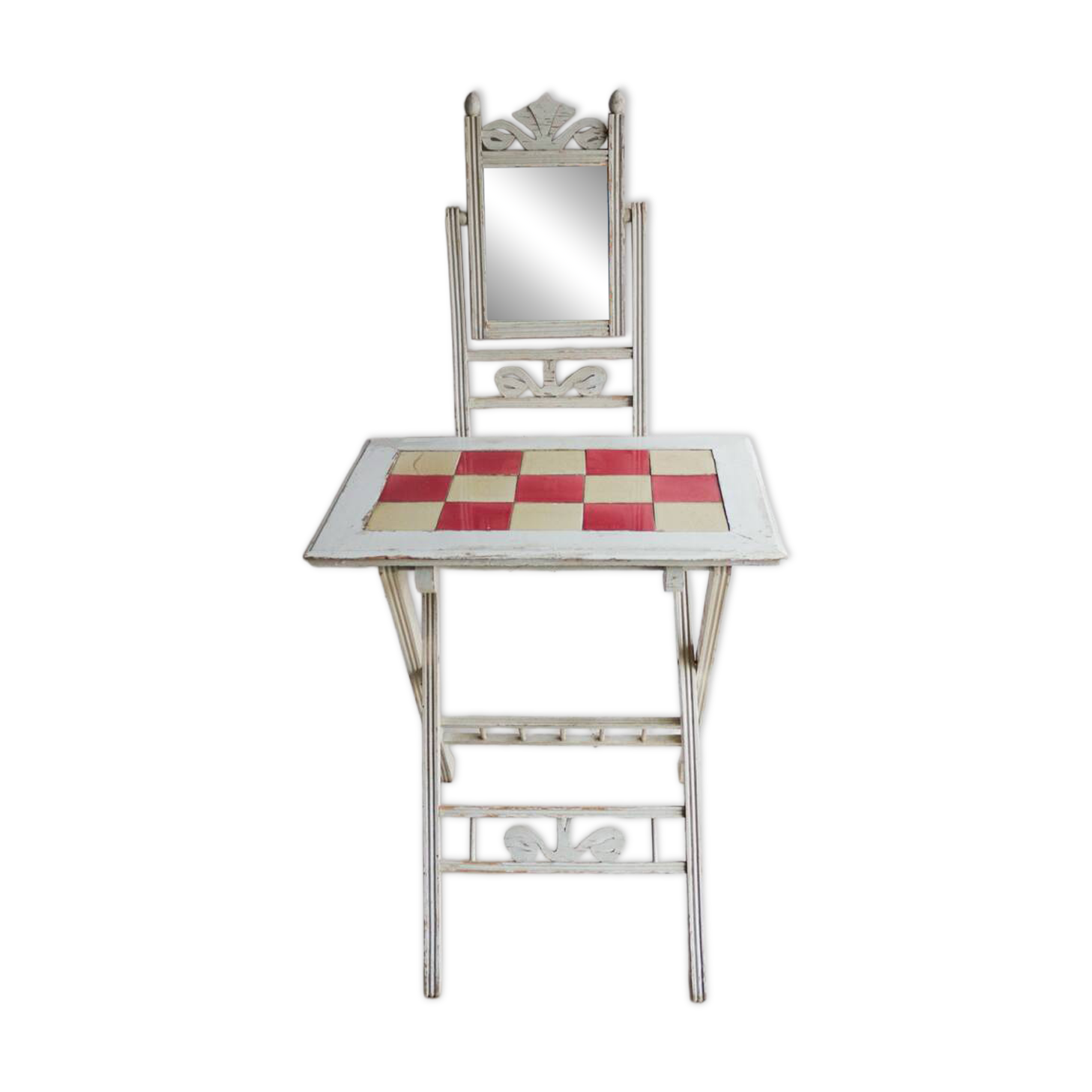 Small antique folding wooden dressing table with tiles and a mercury mirror.