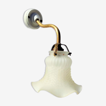 Brass gooseneck wall lamp, with brass socket and porcelain base.