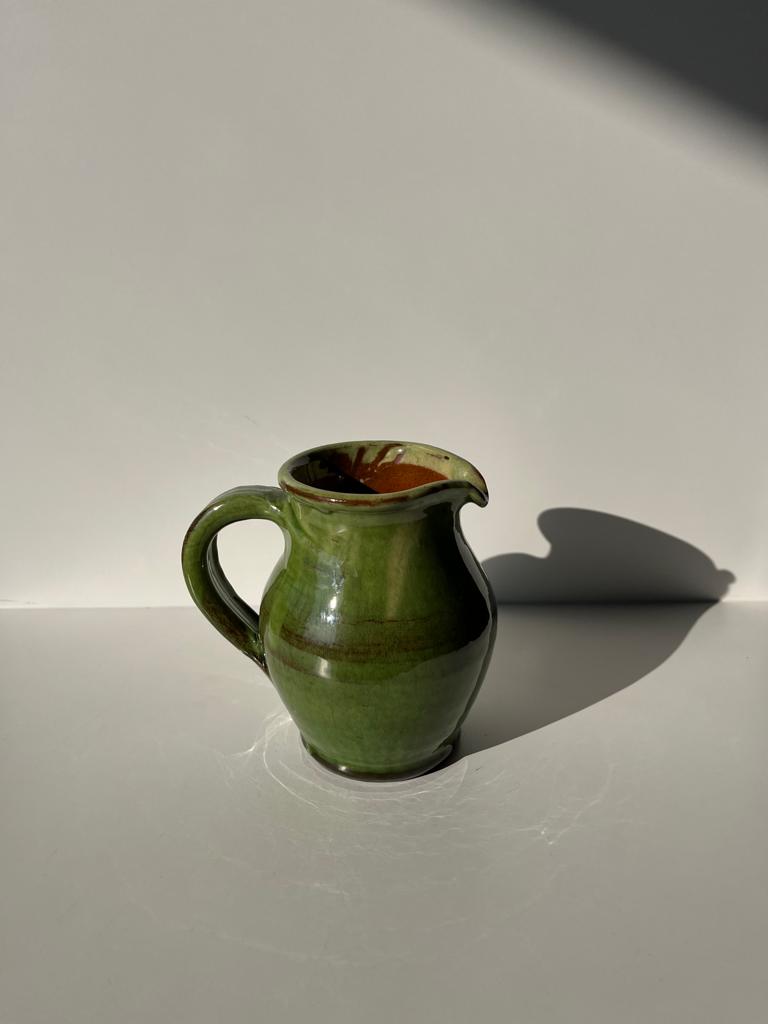 Green glazed ceramic pitcher