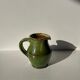 Green glazed ceramic pitcher