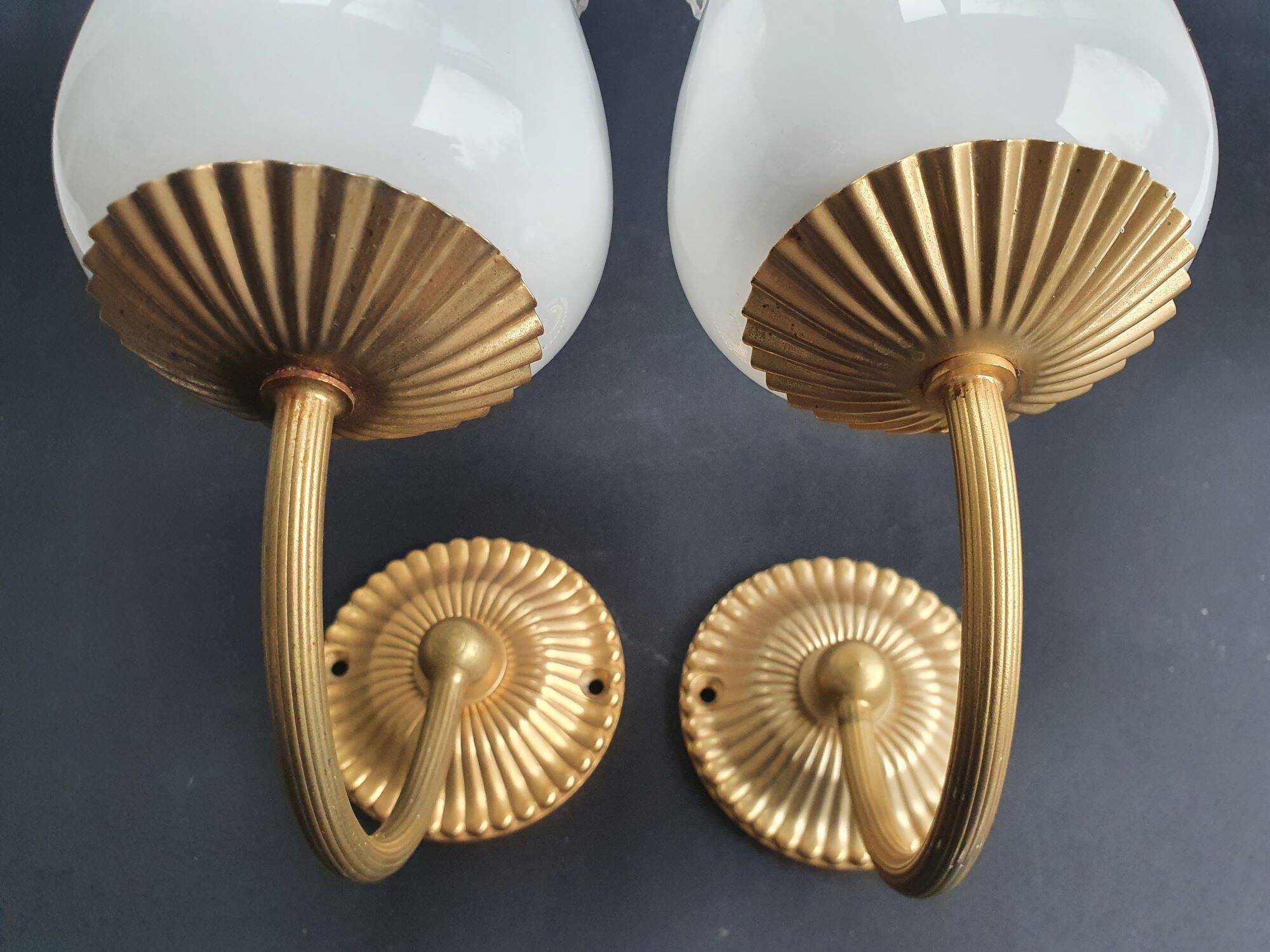 Pair of vintage gold-tone wall sconces with opaline glass globes