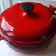 LeCreuset Enzo Mari orange red enamelled cast iron round casserole dish 23 cm perfect condition
