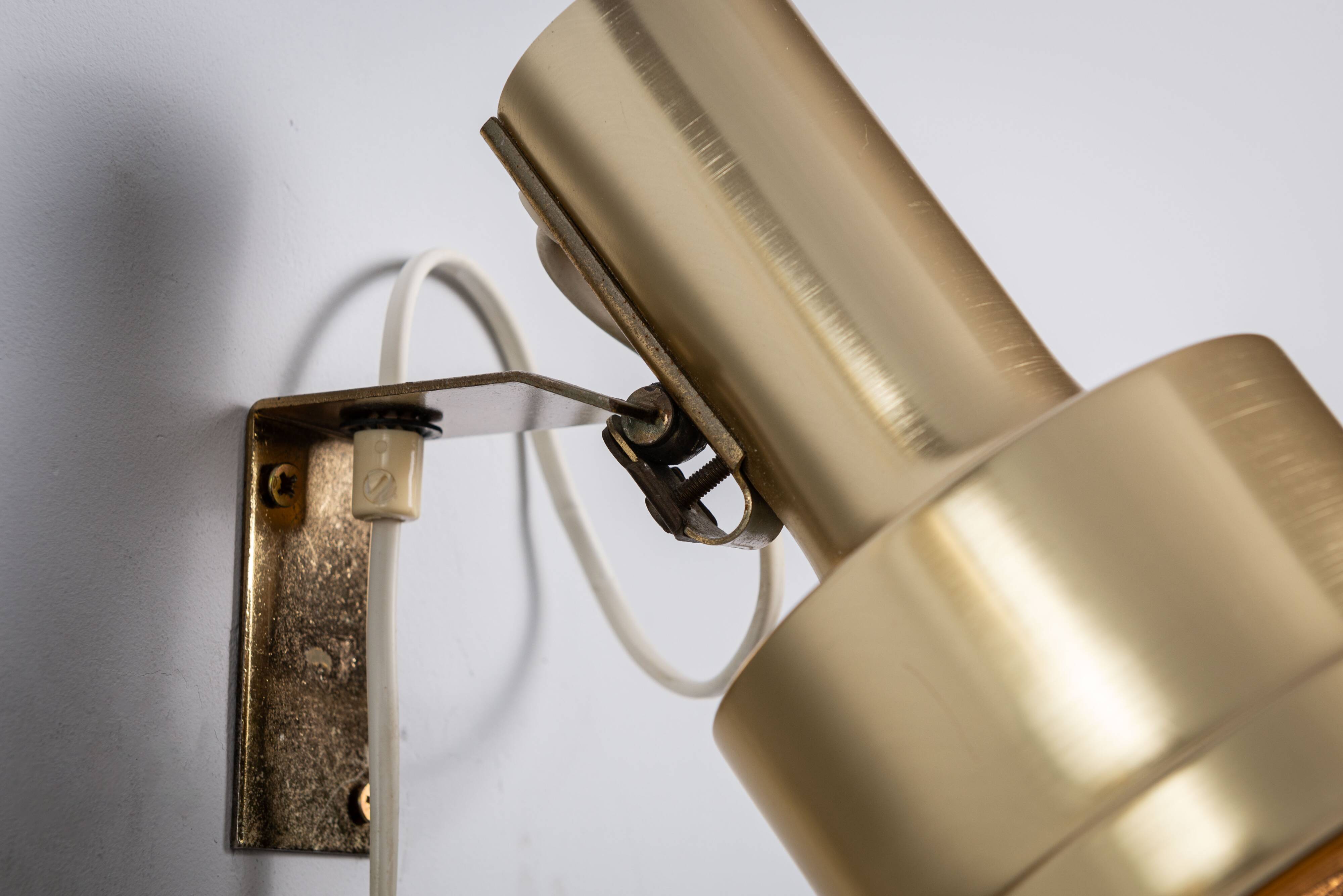 Pair of adjustable wall lamps designed by Per Sundstedt for Kosta Lampan