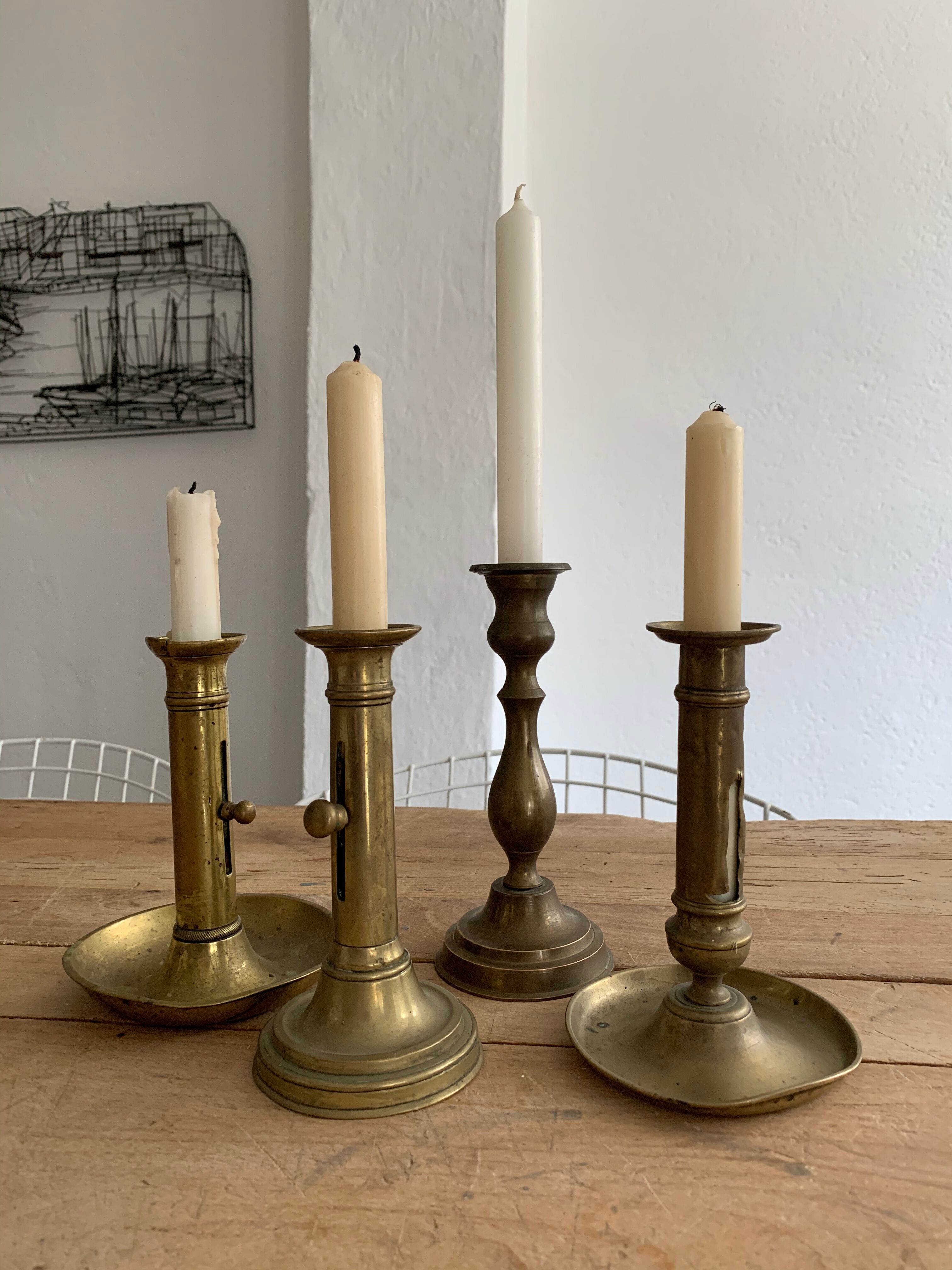 Set 4 vintage brass candlesticks patinated