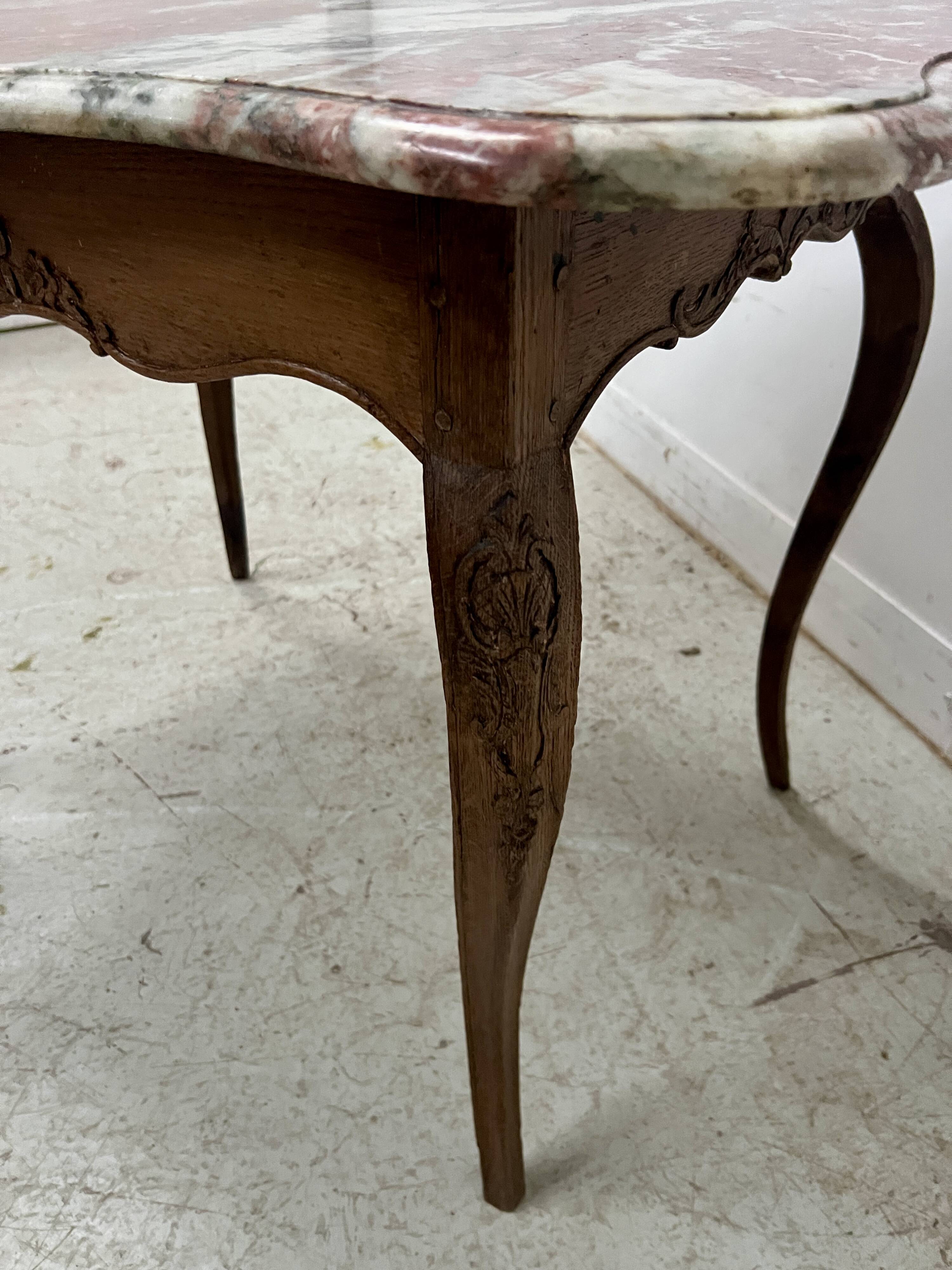 Louis XV mid-table in oak and marble, 18th century.