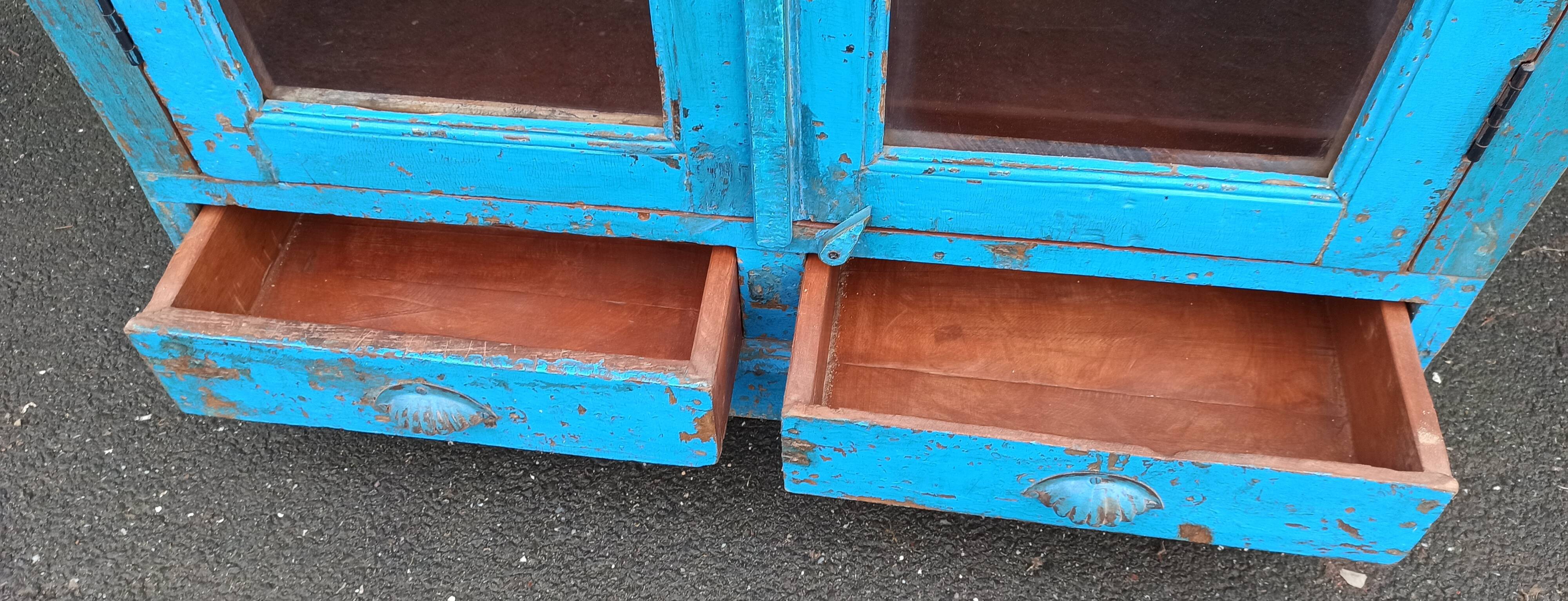 Old wooden glazed cabinet with two doors and two drawers