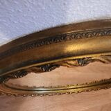 Large round mirror in Spanish gilded carved wood