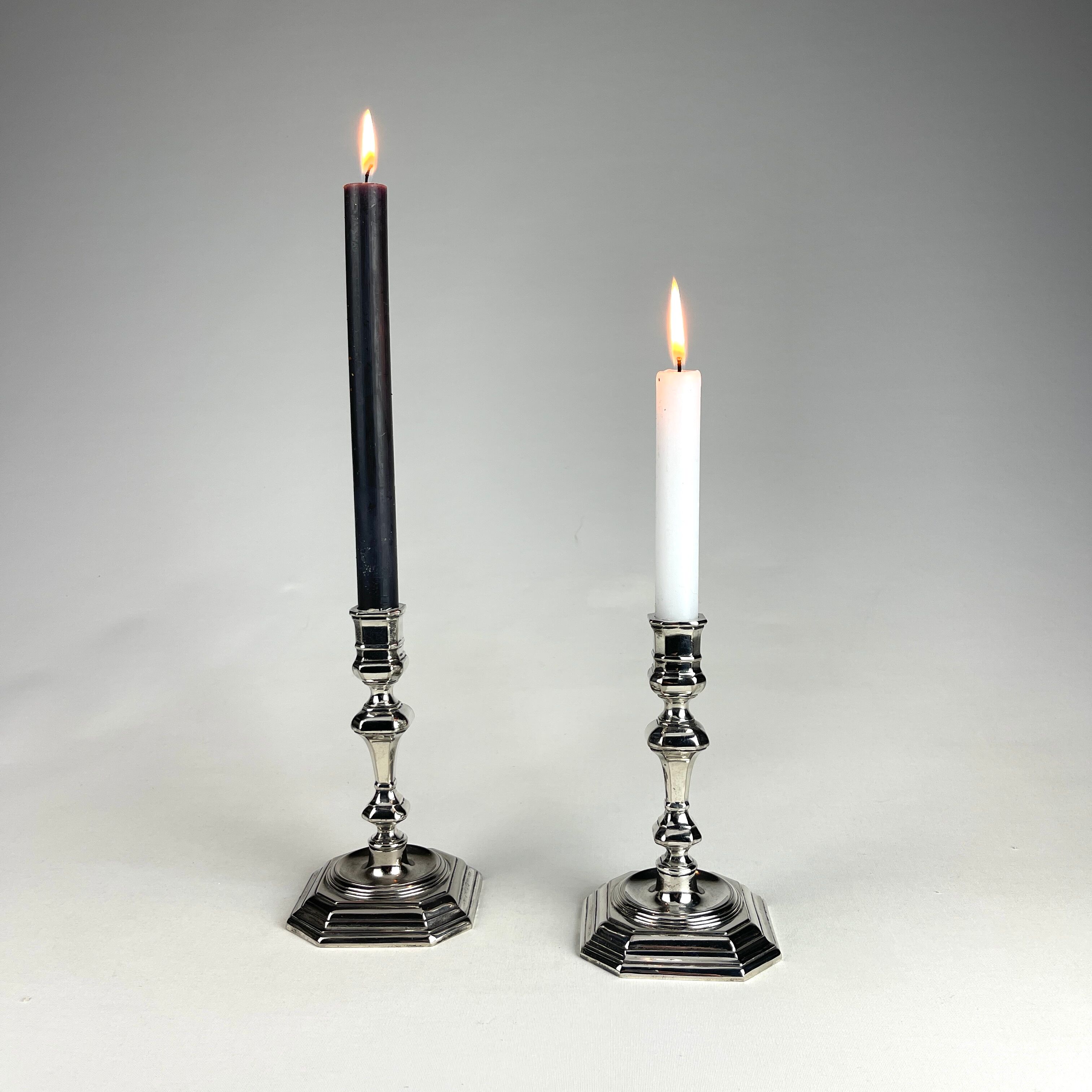 Pair of antique candlesticks in silver metal