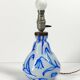 Antique table lamp in opaline glass with blue floral decoration.