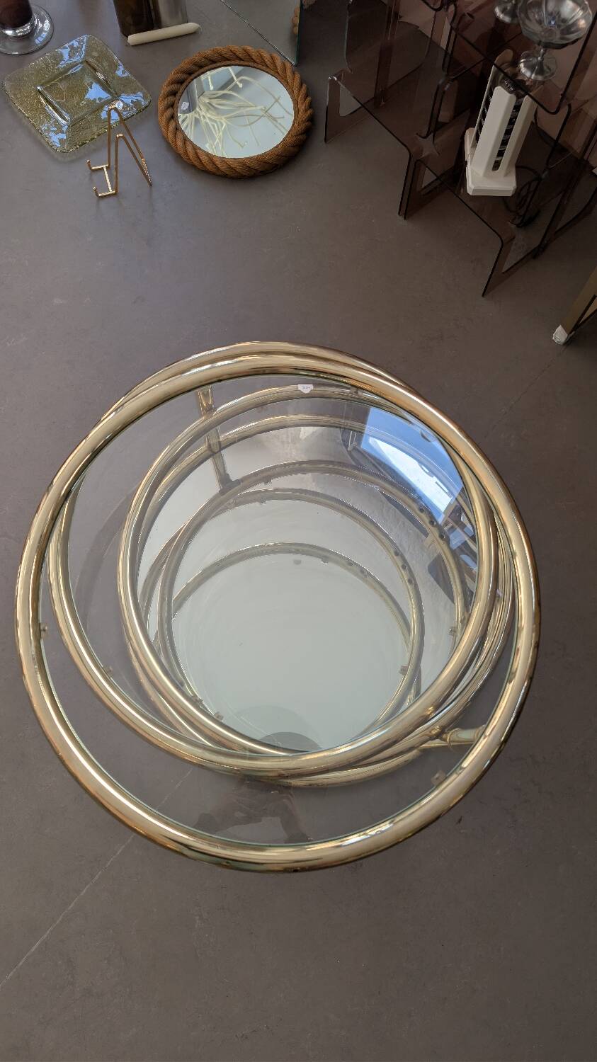 Gold brass coffee table with rotating trays.