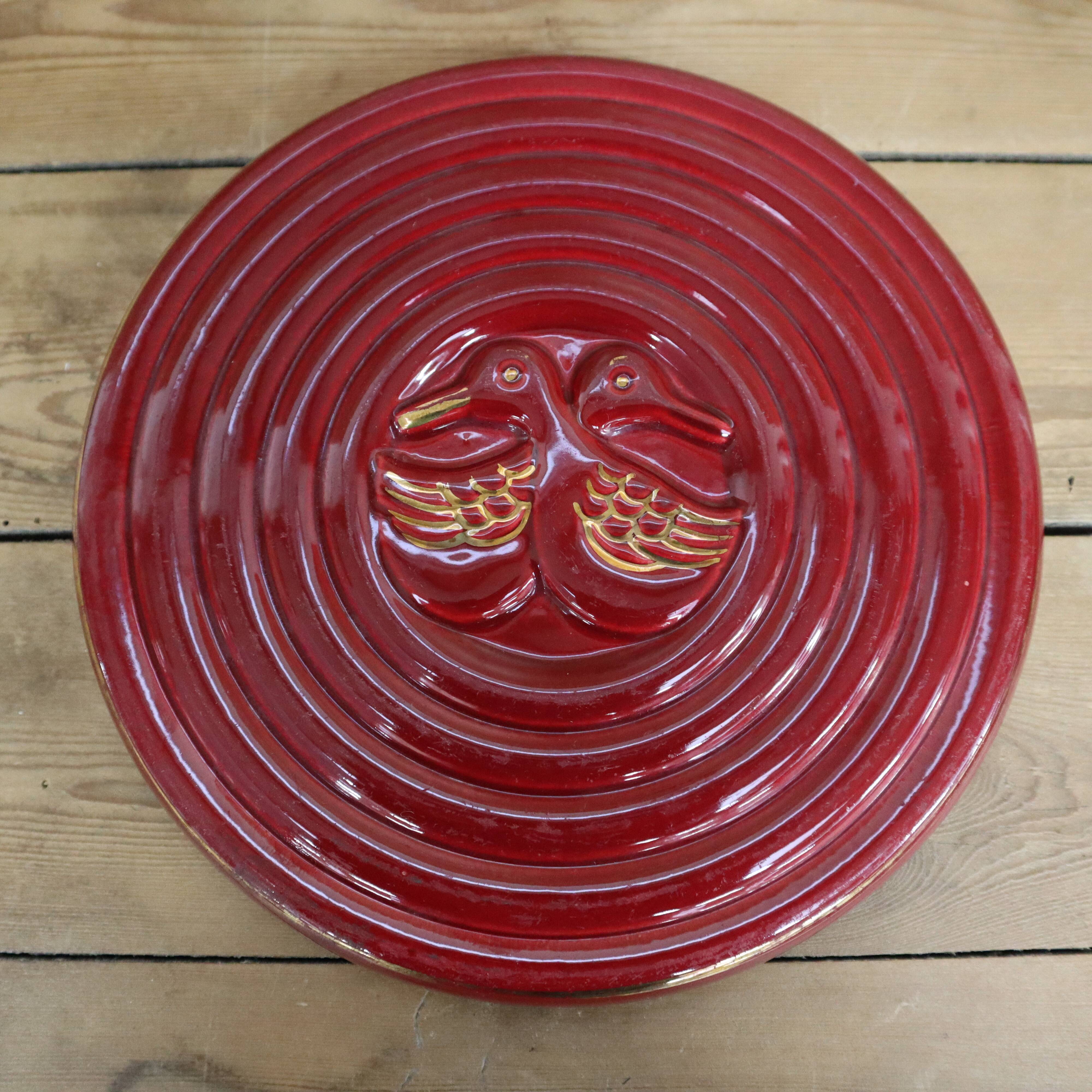 Vintage burgundy duck trivet with gold edging